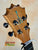 Guitar headstock of KoAloha KTM-00 MG Mango Tenor Ukulele with black tuning pegs