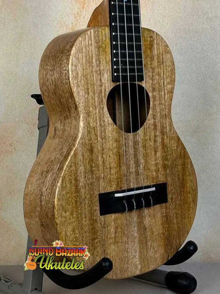 KoAloha KTM-00 MG Mango Tenor Ukulele with ebony fretboard on a stand