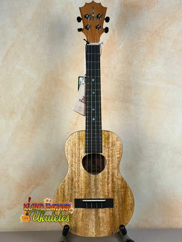 Wooden KoAloha KTM-00 MG Mango Tenor Ukulele showcasing solid mango wood grain patterns