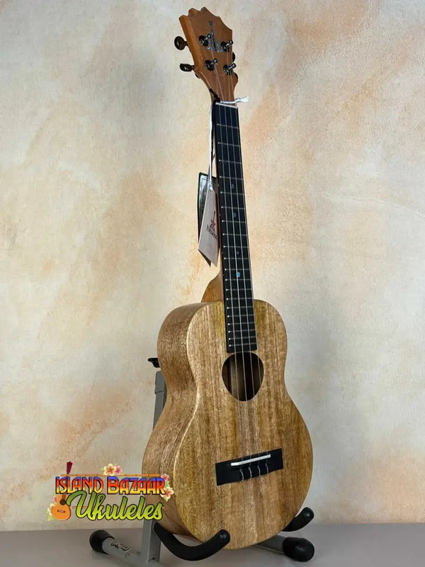 KoAloha KTM-00 MG Mango Tenor Ukulele in Solid Mango Wood on a black stand