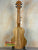 Wooden KoAloha KTM-00 MG Mango Tenor Ukulele displaying solid mango wood grain patterns