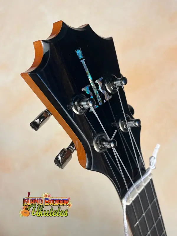 Black guitar headstock with chrome tuning pegs on Koaloha KTM-00 Tenor Ukulele