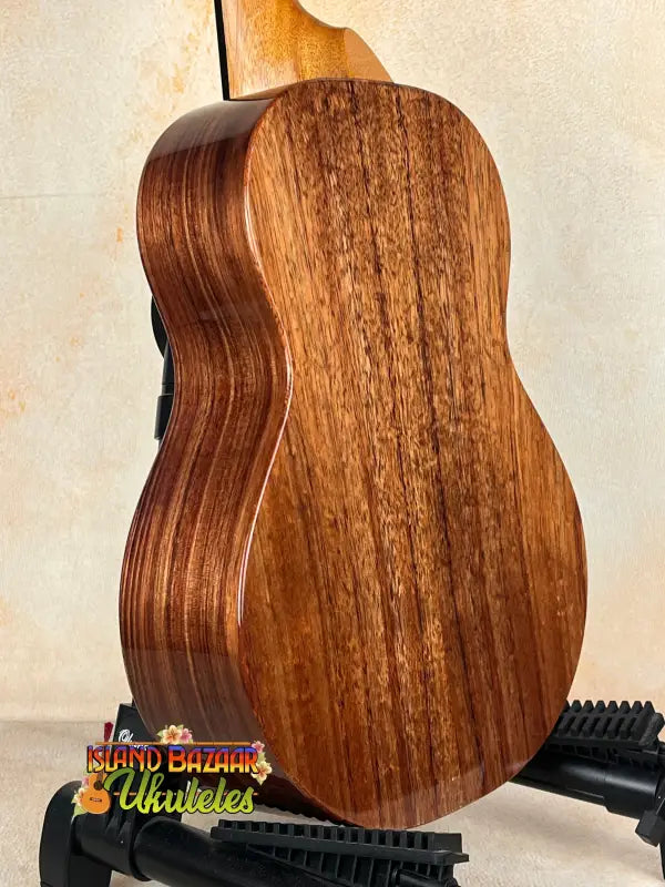 Acoustic guitar with rich brown wood, showcasing Koaloha KTM-00 Tenor and exceptional tone