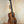 Wooden Koaloha KTM-00 Tenor Ukulele with solid Hawaiian koa and exceptional tone on stand