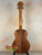 Wooden Koaloha KTM-00 Tenor Ukulele showcasing solid Hawaiian koa and exceptional tone