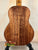 Wooden acoustic guitar with rich brown grain, highlighting Koaloha KTM-00 Tenor’s exceptional tone