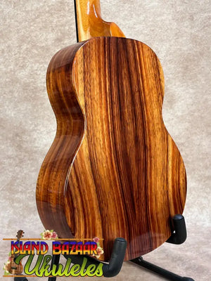 A koaloha ktm-00 tenor ukulele with glossy hawaiian koa zebra wood grain delivering authentic hawaiian sound