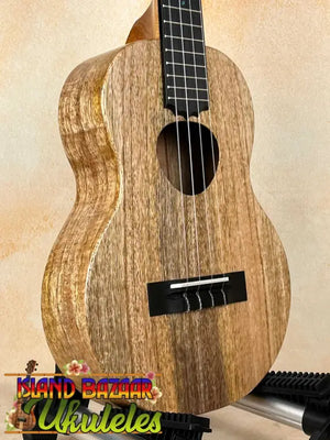 Wooden KoAloha KTM-10RP-MG Tenor Mango Ukulele showcasing natural grain patterns