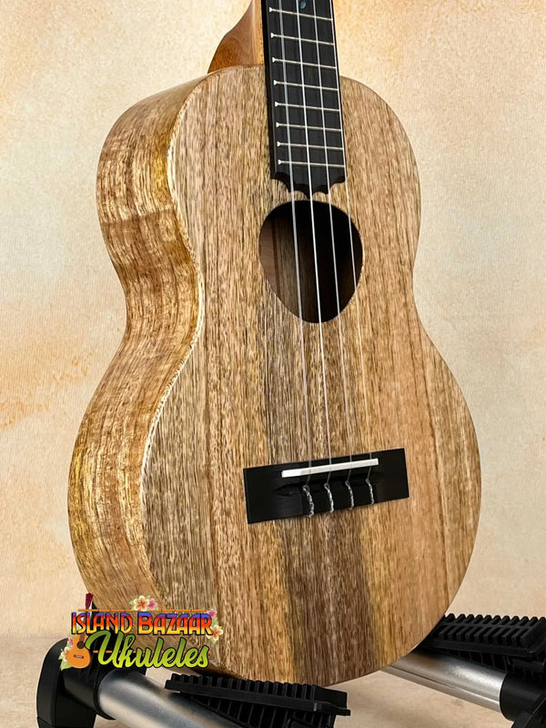 Wooden KoAloha KTM-10RP-MG Tenor Mango Ukulele showcasing natural grain patterns