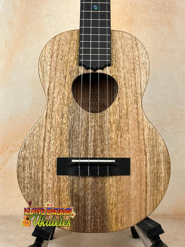 Wooden KoAloha KTM-10RP-MG Tenor Mango Ukulele with natural grain and black fretboard