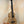 Wooden ukulele with natural grain finish and black strings, KoAloha KTM-10RP-MG Tenor