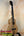 Wooden ukulele with natural grain finish and black strings, KoAloha KTM-10RP-MG Tenor