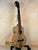 Wooden ukulele with natural grain finish and black strings, KoAloha KTM-10RP-MG Tenor