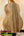 Wooden acoustic guitar showcasing wood grain in KoAloha KTM-10RP-MG Tenor Mango Ukulele