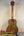 Wooden ukulele with dark tuning pegs and natural grain for KoAloha KTO-10 Opio Tenor