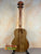 Wooden ukulele with dark tuning pegs and natural grain for KoAloha KTO-10 Opio Tenor