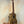 Wooden KoAloha KTO-10 Opio Tenor Ukulele on black stand with gig bag