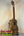 Wooden KoAloha KTO-10 Opio Tenor Ukulele on black stand with gig bag