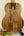 KoAloha KTO-10 Opio Tenor Ukulele with striped wood grain pattern on a black stand