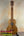 Wooden KoAloha Opio Concert Ukulele showcasing natural grain patterns and gig bag