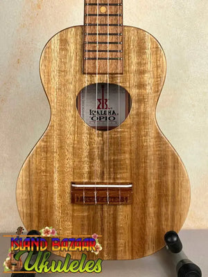Wooden ukulele with natural finish, showcasing wood grain pattern in KoAloha Opio Concert