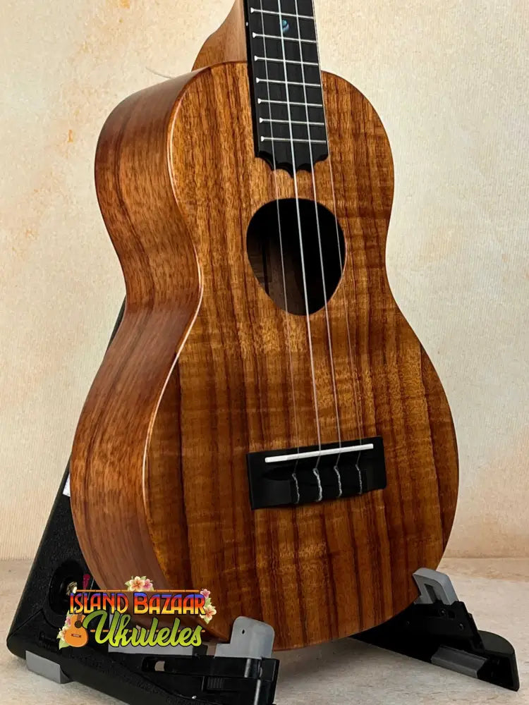 Beautiful Koa wood Ukulele with dark grain patterns from KoAloha Royal Pikake KCM-00RP