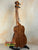 Wooden ukulele with brown finish and black tuning pegs, KoAloha Royal Pikake KCM-00RP