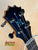 Guitar headstock with blue inlay and black pegs for KoAloha Royal Pikake KCM-00RP