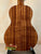 Acoustic guitar featuring richly striped Koa wood back panel of KoAloha Royal Pikake Concert