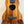 Wooden ukulele with koa finish and black fretboard, perfect for the KoAloha Royal Pikake Concert