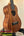 Wooden ukulele on stand, Koaloha Royal Pikake Tenor Uke with solid Hawaiian koa