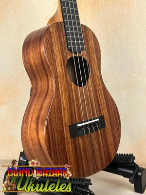 Wooden ukulele on stand, Koaloha Royal Pikake Tenor Uke with solid Hawaiian koa