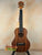 Brown wooden ukulele from Koaloha Royal Pikake Royal Pikake Tenor, made with solid Hawaiian Koa
