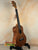 Brown wooden ukulele from Koaloha Royal Pikake series, royal pikake tenor, solid Hawaiian koa