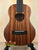 Brown wood ukulele showcasing the Koaloha Royal Pikake Royal Pikake Tenor with solid Hawaiian koa finish