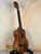 Wooden ukulele with dark grain patterns from the Koaloha Royal Pikake Tenor KTM-10RP