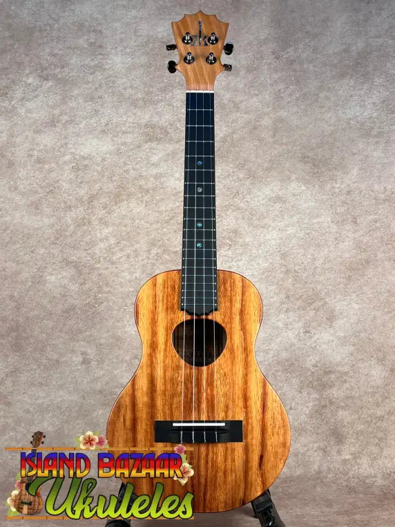Koaloha tenor matte finish Hawaiian ukulele with koa wood body and black tuning pegs