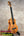 Light brown wooden Koaloha Tenor Hawaiian ukulele with matte finish and black tuning pegs