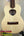 Light-colored wooden KoAloha Tenor Opio with heart-shaped sound hole and case