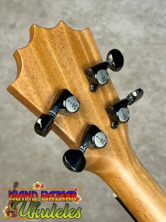 Back of Koaloha Royal Pikake Tenor ukulele headstock with four black tuning pegs in matte finish