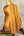 Back of koaloha royal pikake tenor ukulele in matte finish on black stand with solid Hawaiian koa