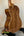 Acoustic guitar with walnut back on stand, featuring Luna Vista Deer Tenor Electric design