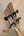 Guitar headstock with black tuning pegs on Mann Electric Tenor Ukulele solid body