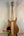 Natural wood Mann Electric Tenor Ukulele with sleek modern solid body design