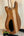 Wooden electric guitar body with light center stripe, Mann Electric Tenor Ukulele design
