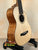 Wooden ukulele on stand from Mya-Moe Long Neck Tenor Ukulele spruce top koa back