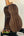 Wooden acoustic guitar on black stand, showcasing Nebula Tenor Ukulele craftsmanship