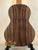 Acoustic guitar with dark wood grain showcasing Nebula Tenor Ukulele craftsmanship