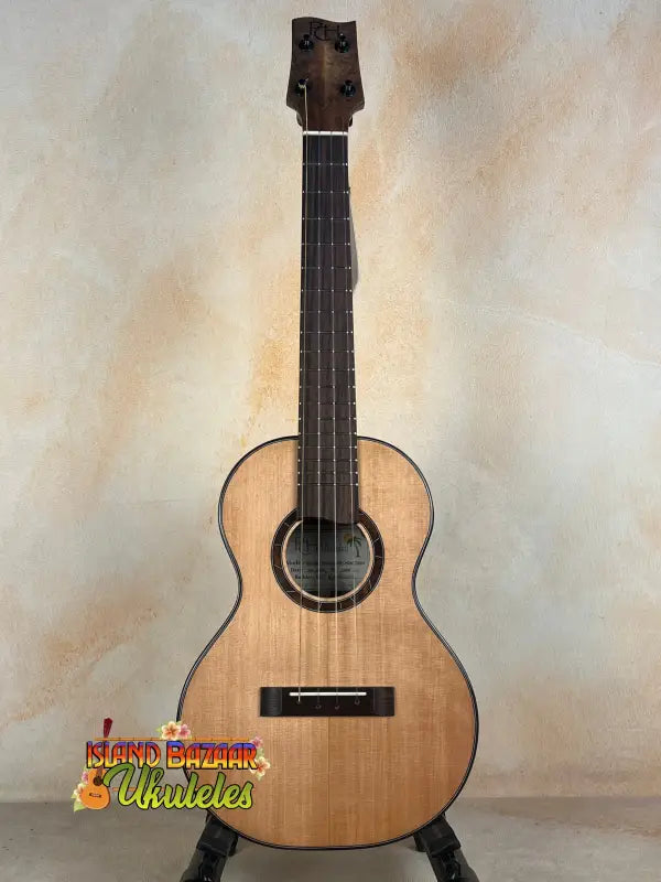 Natural wood Nebula Tenor Ukulele showcasing Western Red Cedar and Claro Walnut craftsmanship