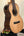 Wooden Nebula Tenor Ukulele in Western Red Cedar and Claro Walnut on a stand